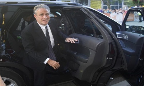 Photo Of Jon Stewart with his car.